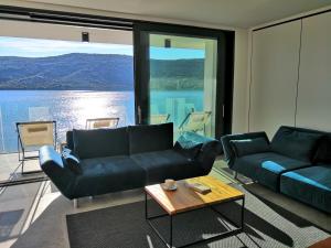 a living room with a couch and a table at Sky Beach Aparthotel in Marina