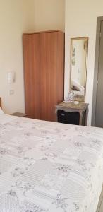 Postel nebo postele na pokoji v ubytování Hotel Margherita Meublè