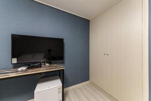 TV a/nebo společenská místnost v ubytování It's W