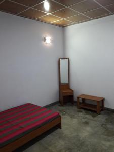 Säng eller sängar i ett rum på ULPATHA NATURE RESORT