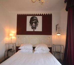 Letto o letti in una camera di Hôtel Vauban