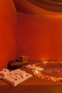 a room with a fire place, candles, and candles on the floor at Atlas Medina & Spa in Marrakesh