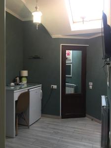 Kuchyň nebo kuchyňský kout v ubytování Nicolas Boutique Hotel