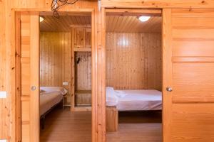 Posteľ alebo postele v izbe v ubytovaní Camping Los Llanos