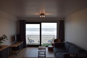 Χώρος καθιστικού στο Residentie Sea Flower II, 5de verdieping