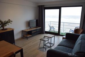 Μια τηλεόραση ή/και κέντρο ψυχαγωγίας στο Residentie Sea Flower II, 5de verdieping
