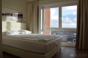 Ένα ή περισσότερα κρεβάτια σε δωμάτιο στο Appartement Lucia, 8ste verdieping