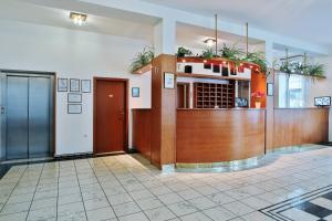 a lobby with a reception desk in a building at Attic Hotel in Prague