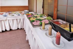 a buffet line with many different types of food at Attic Hotel in Prague