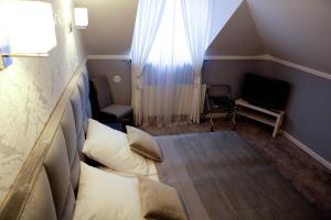 Ein Bett oder Betten in einem Zimmer der Unterkunft Hotel Bellis