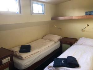 Postel nebo postele na pokoji v ubytování Botel Elodie