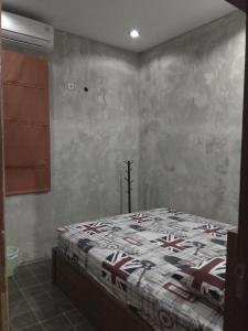 Cama o camas de una habitación en Griyo Jagalan