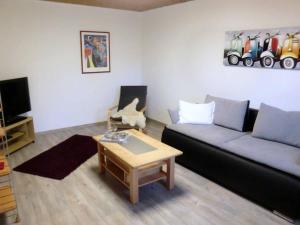 a living room with a couch and a coffee table at Ferienwohnung Bozsik in Schweinfurt