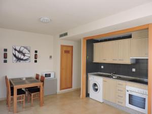 A kitchen or kitchenette at La Manga Apartments - Punta Cormoran