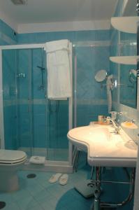Koupelna v ubytování Le Cheminée Business Hotel Napoli