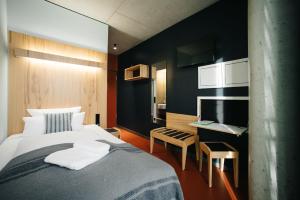 Postel nebo postele na pokoji v ubytování Hotel Rossi
