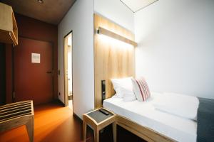 Postel nebo postele na pokoji v ubytování Hotel Rossi