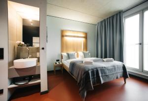 Postel nebo postele na pokoji v ubytování Hotel Rossi