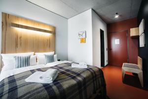 Postel nebo postele na pokoji v ubytování Hotel Rossi