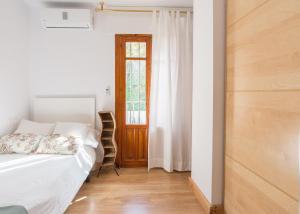 Posteľ alebo postele v izbe v ubytovaní Mundo Nuevo: Acogedor Apartamento en el Centro