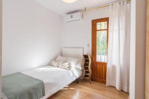 Posteľ alebo postele v izbe v ubytovaní Mundo Nuevo: Acogedor Apartamento en el Centro