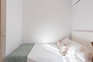 Posteľ alebo postele v izbe v ubytovaní Mundo Nuevo: Acogedor Apartamento en el Centro