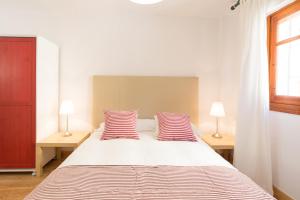 Posteľ alebo postele v izbe v ubytovaní Mundo Nuevo: Acogedor Apartamento en el Centro