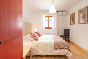 Posteľ alebo postele v izbe v ubytovaní Mundo Nuevo: Acogedor Apartamento en el Centro
