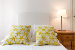 Posteľ alebo postele v izbe v ubytovaní Mundo Nuevo: Acogedor Apartamento en el Centro