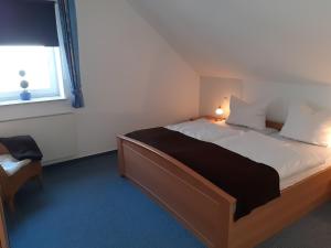 Cama ou camas em um quarto em Ferienwohnungen Sonnenpfad