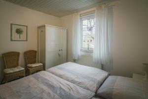 מיטה או מיטות בחדר ב-Boer