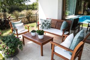 A seating area at Villa Mertcan by Important Group Travel BD439