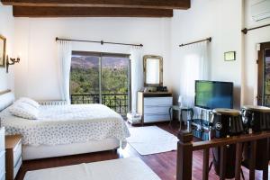 A television and/or entertainment centre at Villa Mertcan by Important Group Travel BD439