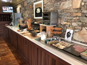 a bakery with a counter with food on it at Castel Vecchio in Ajaccio