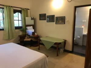 Postel nebo postele na pokoji v ubytování Cinnamon Bungalow