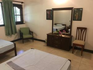 Postel nebo postele na pokoji v ubytování Cinnamon Bungalow