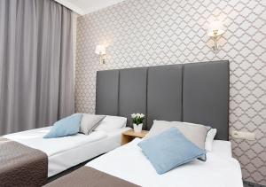 Llit o llits en una habitació de Villa Grand Solis
