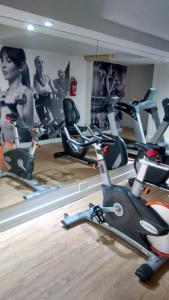 a gym with several exercise bikes in a room at Ex Loi Suites Arenales in Buenos Aires