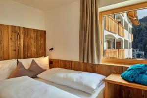 Postel nebo postele na pokoji v ubytování Hotel Christiania