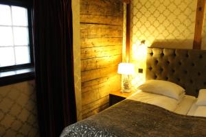 Postel nebo postele na pokoji v ubytování Det Hanseatiske Hotel