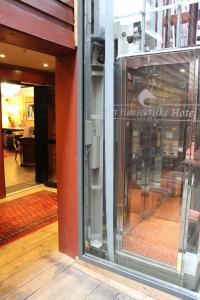 
a door that is open in a building at Det Hanseatiske Hotel in Bergen
