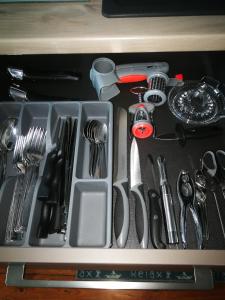 a drawer full of kitchen utensils in a drawer at lupin in Rochefort