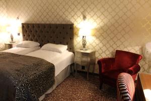 Postel nebo postele na pokoji v ubytování Det Hanseatiske Hotel