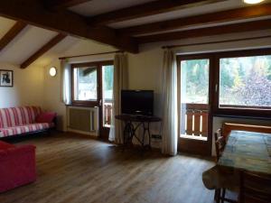 TV a/nebo společenská místnost v ubytování Casa Angela