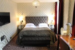 Postel nebo postele na pokoji v ubytování Det Hanseatiske Hotel