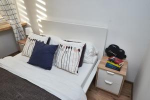Posteľ alebo postele v izbe v ubytovaní Noctis Apartment Pańska II