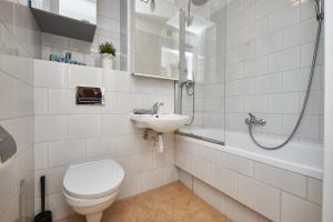 Kúpeľňa v ubytovaní Noctis Apartment Pańska II