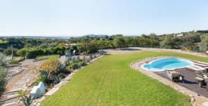 an aerial view of a yard with a swimming pool at Paradise Villa Cabanita Loulé in Loulé