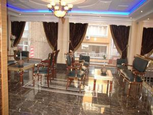 A seating area at Alfa Hotel