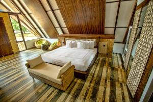 Postel nebo postele na pokoji v ubytování Liyya Water Villas